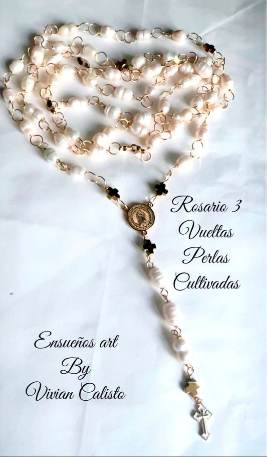 Pearl rosary with gold accents on a light blue background, featuring text about the creator.